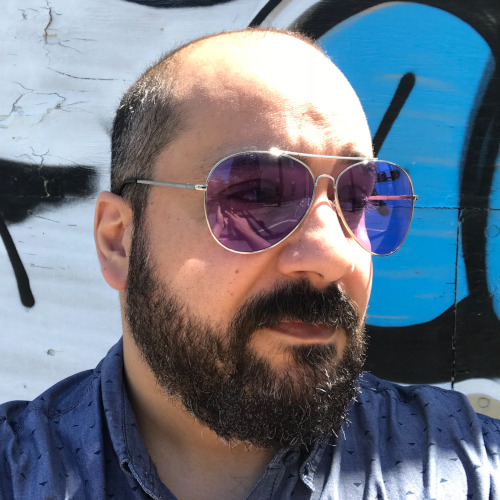 Neil, wearing purple sunglasses